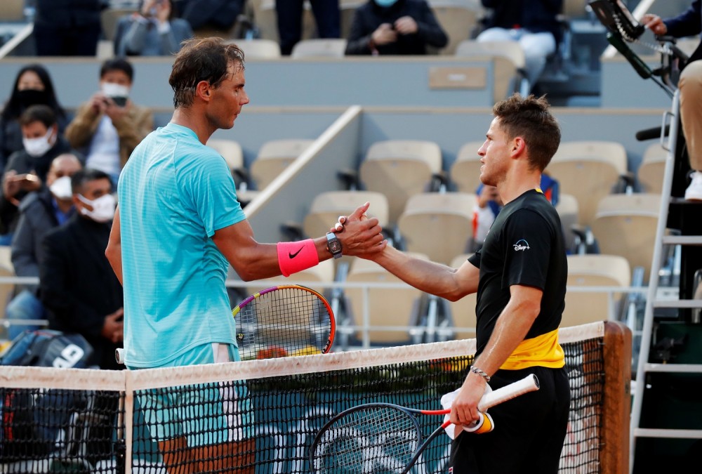 Tennis - French Open - Roland Garros, Paris, France - October 9, 2020 Spain's Rafael Nadal shakes hands with Argentina's Diego Schwartzman after winning the semi final match REUTERS/Charles Platiau