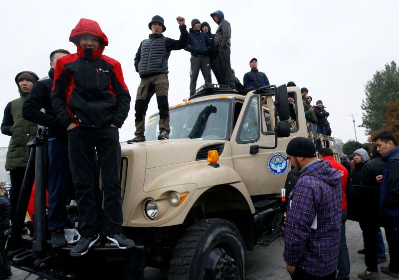 Demonstrators stand atop a vehicle during a protest against the results of a parliamentary election in Bishkek, Kyrgyzstan on October 6, 2020. (REUTERS Photo)