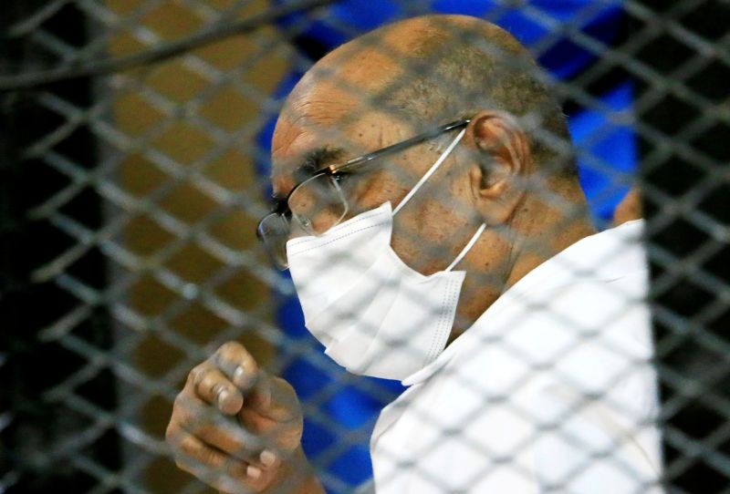 Sudan's ousted President Omar al-Bashir is seen inside the defendant's cage during his and some of his former allies trial over the 1989 military coup that brought the autocrat to power in 1989, at a courthouse in Khartoum, Sudan September 15, 2020. (REUTERS File Photo)