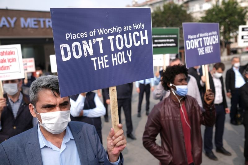 Demonstrators hold banners during a protest against France, in Istanbul,Turkey October 27, 2020. (REUTERS Photo)