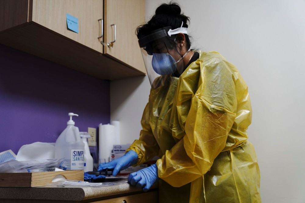 The COVID-19 response specialist Alexandra Vizcarra prepares to administer a nasal swab test at Public Health Madison & Dane County as the coronavirus disease (COVID-19) outbreak continues in Madison, Wisconsin, U.S., October 19, 2020. REUTERS/Bing Guan