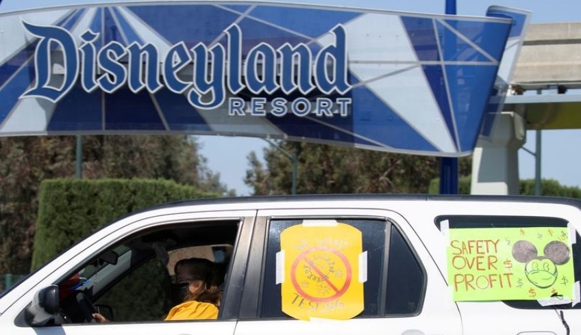 FILE PHOTO: Coalition of Resort Labor Unions representing Disney cast members stage a car caravan outside Disneyland California, calling for higher safety standards for Disneyland to reopen during the global outbreak of the coronavirus disease (COVID-19) in Anaheim, California, U.S., June 27, 2020. REUTERS/Mike Blake/File Photo