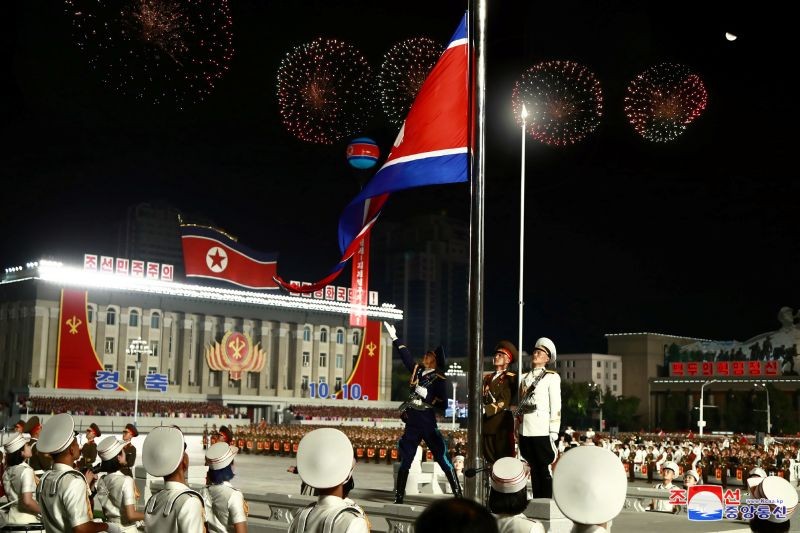 The North Korean flag waves during a parade to mark the 75th anniversary of the founding of the ruling Workers' Party of Korea, in this image released by North Korea's Central News Agency on October 10, 2020. (REUTERS Photo)