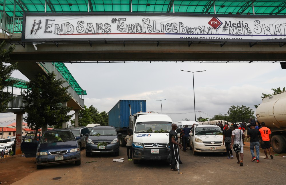 Vehicles are parked on the road due to roadblock as authorities imposed a round-the-clock curfew on the Nigerian state of Lagos, in response to protests against alleged police brutality, Nigeria October 20, 2020. REUTERS/Temilade Adelaja