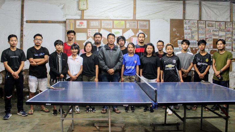 Rev H Sangkap, Pastor, TTBL and Mosha Lashem APY, TTBL with the winners of the 1st Tuensang Town Baptist Church Youth Department TT tournament.