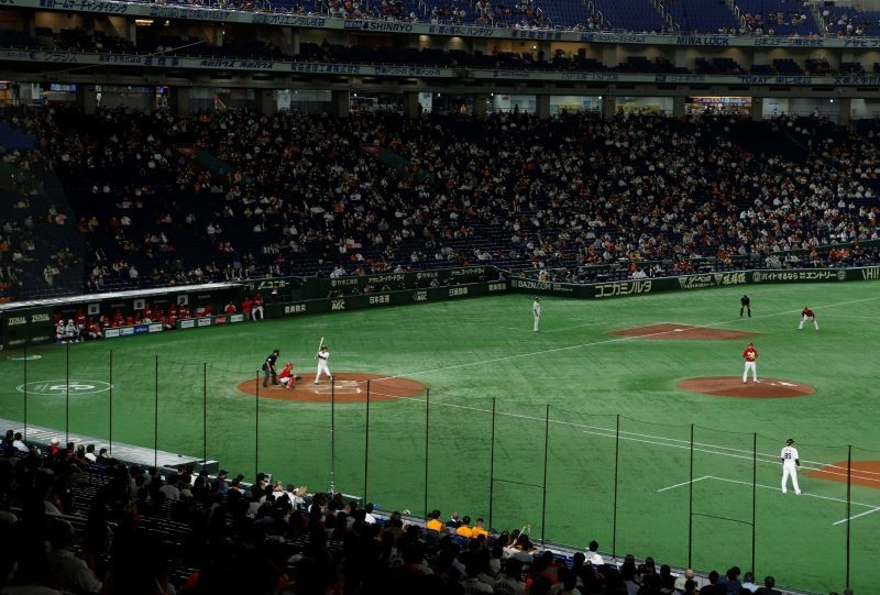 Fans watch Nippon Professional Baseball Game between Yomiuri Giants and Hiroshima Carp at Tokyo dome in Tokyo, Japan October 15, 2020. Picture taken October 15, 2020. REUTERS/Jack Tarrant