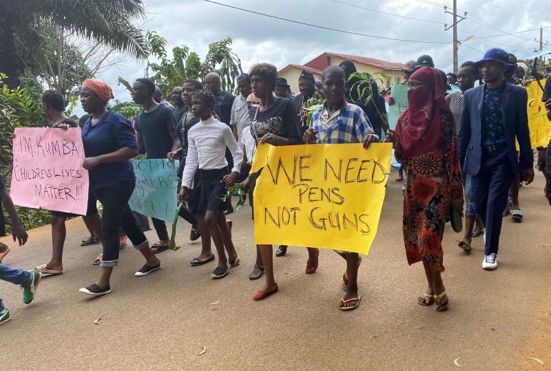 Schoolchildren, their parents and teachers hold a protest after gunmen opened fire at a school, killing at least six children as authorities claim, in Kumba, Cameroon October 25, 2020. (REUTERS Photo)