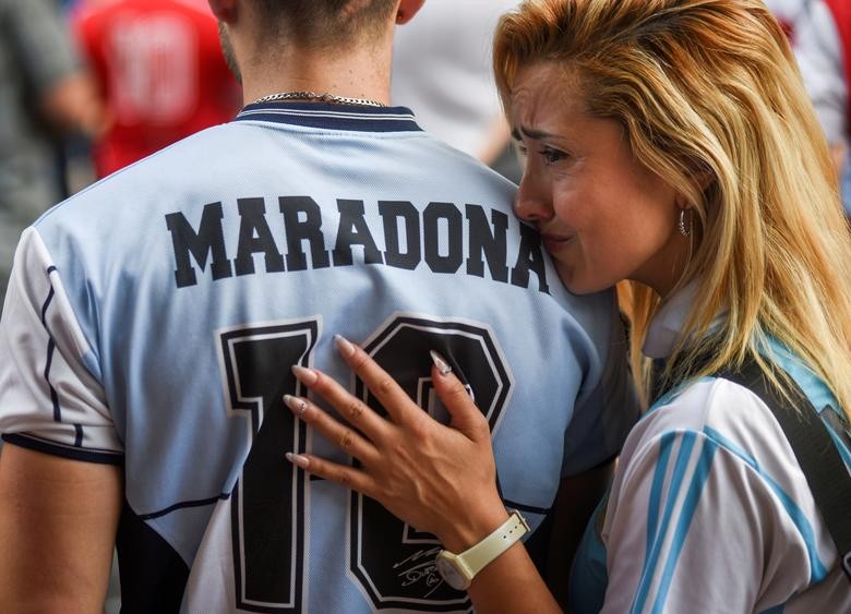 People gather to mourn the death of soccer legend Diego Maradona, outside the Diego Armando Maradona Stadium, in Buenos Aires, Argentina on November 25. (Reuters Photo)