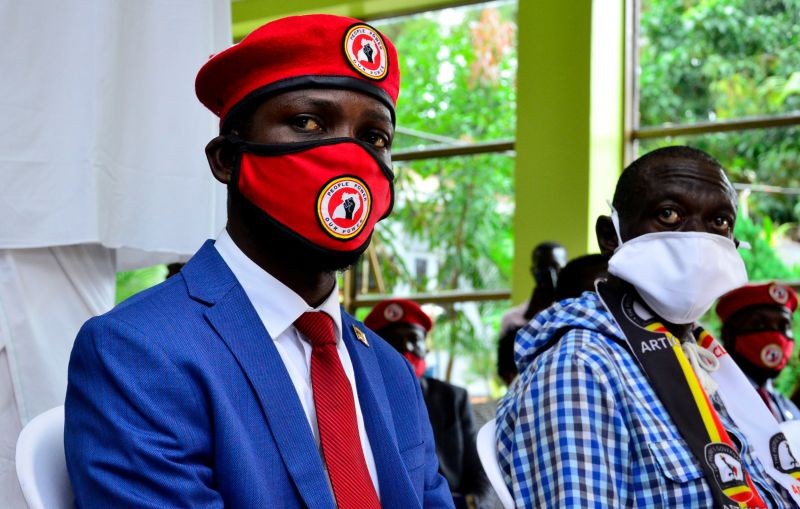 Ugandan musician turned politician, Robert Kyagulanyi, also known as Bobi Wine, and Uganda's four time Presidential candidate Kizza Besigye attend a joint news conference over the government handling of the coronavirus disease (COVID-19) pandemic and a possible alliance against President Yoweri Museveni in the upcoming elections, in Wakiso district, in Kampala, Uganda June 15, 2020. (REUTERS File Photo)