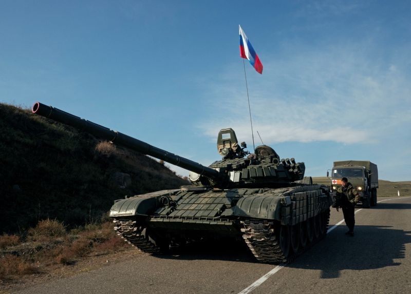 A service member of the Russian peacekeeping troops stands next to a tank near the border with Armenia, following the signing of a deal to end the military conflict between Azerbaijan and ethnic Armenian forces, in the region of Nagorno-Karabakh, November 10, 2020. (REUTERS Photo)