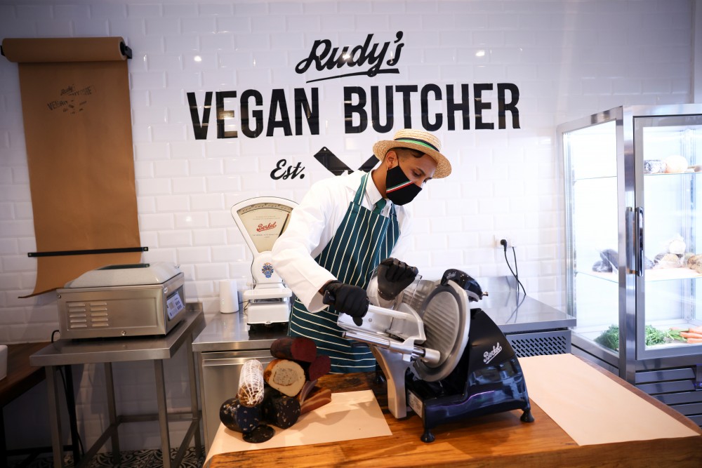 A member of staff works inside 'Rudy's Vegan Butcher' shop, amid the coronavirus (COVID-19) outbreak, in London, Britain, October 30, 2020. Picture taken October 30, 2020. REUTERS/Henry Nicholls