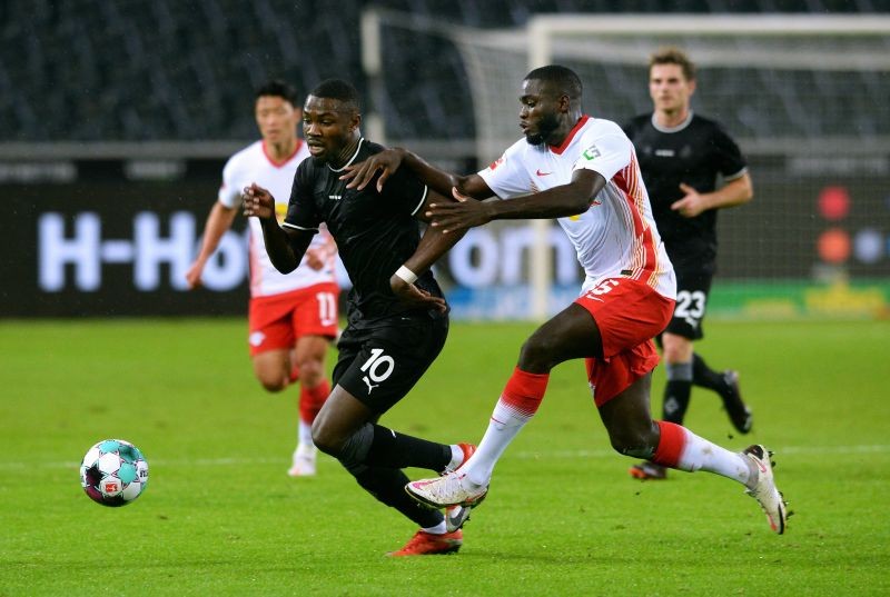 Borussia Moenchengladbach's Marcus Thuram in action with RB Leipzig's Dayot Upamecano Pool via REUTERS/Uwe Kraft DFL regulations prohibit any use of photographs as image sequences and/or quasi-video.