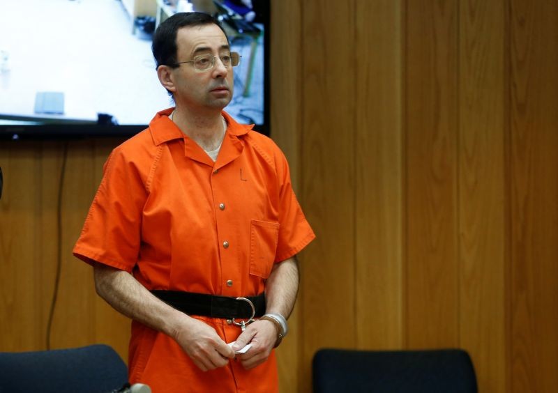 Larry Nassar, a former team USA Gymnastics doctor who pleaded guilty in November 2017 to sexual assault charges, stands in court during his sentencing hearing in the Eaton County Court in Charlotte, Michigan, U.S., February 5, 2018. REUTERS/Rebecca Cook/File Photo