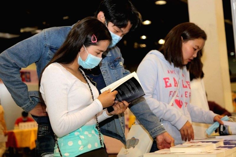 Readers select books at a book festival in Ulan Bator, Mongolia. (IANS Photo)