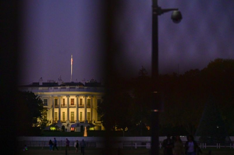 The White House is seen behind a security fence the evening after a presidential election victory was called for former Vice President Joe Biden, in Washington, U.S., November 8, 2020. REUTERS/Erin Scott