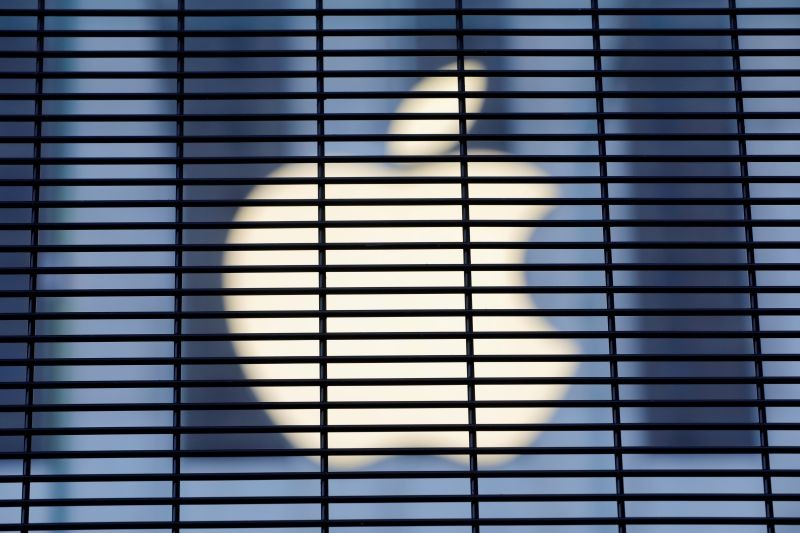 The Apple logo is seen through a security fence erected around the Apple Fifth Avenue store as votes continue to be counted following the 2020 U.S. presidential election, in Manhattan, New York City, U.S., November 5, 2020. (REUTERS File Photo)