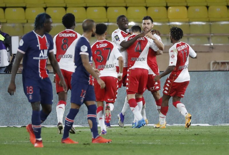 AS Monaco's Cesc Fabregas celebrates scoring their third goal with teammates REUTERS/Eric Gaillard