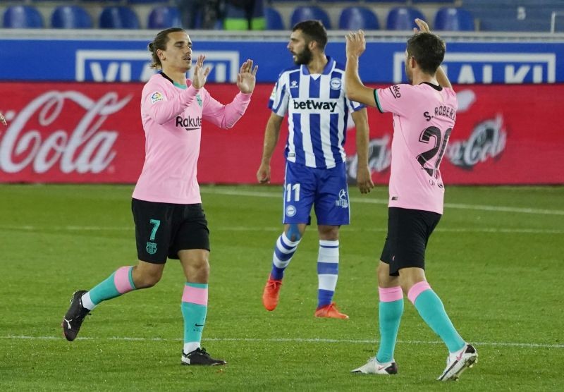 Barcelona's Antoine Griezmann celebrates scoring their first goal with teammates REUTERS/Vincent West