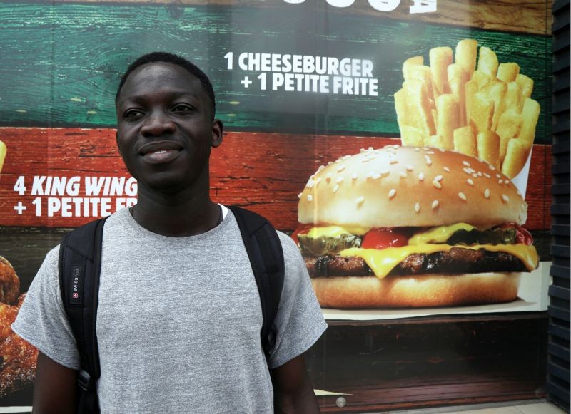 Student Ange Kouame, 23, reacts to the 2020 U.S. presidential election in front of a fast food restaurant during a vox pop in Abidjan, Ivory Coast November 5, 2020. (REUTERS Photo)
