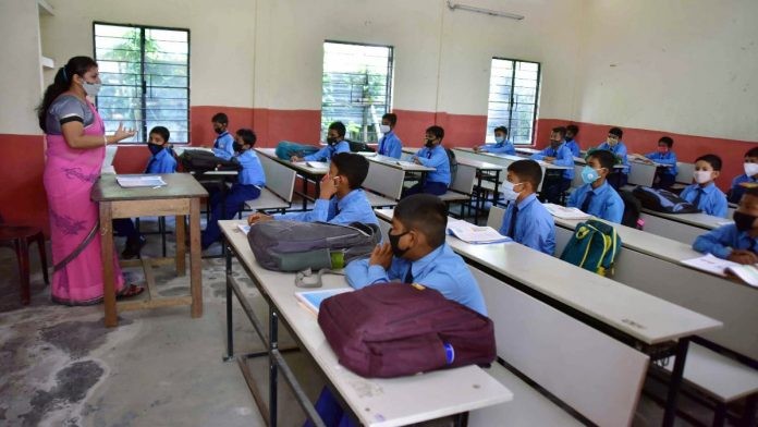 Students attend a class after schools re-opened in Nagaon district of Assam on 2 November 2020 | ANI