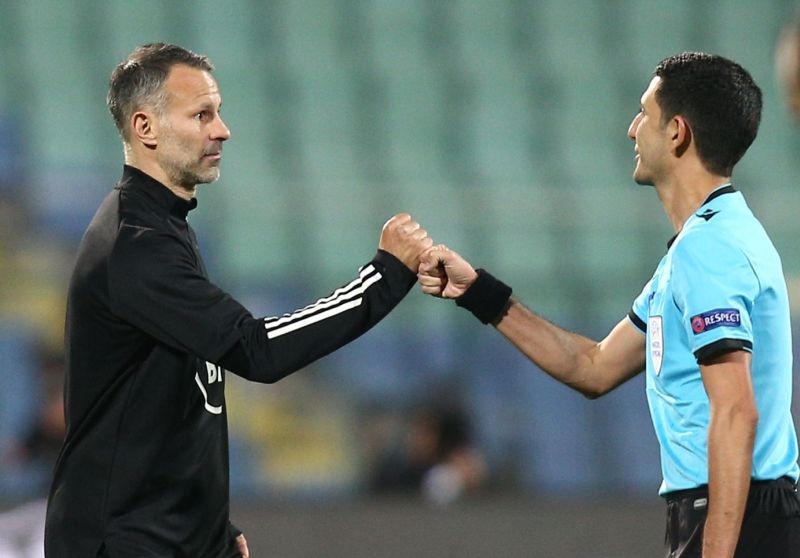 FILE PHOTO: Wales manager Ryan Giggs with referee Aliyar Aghayev after the match REUTERS/Stoyan Nenov
