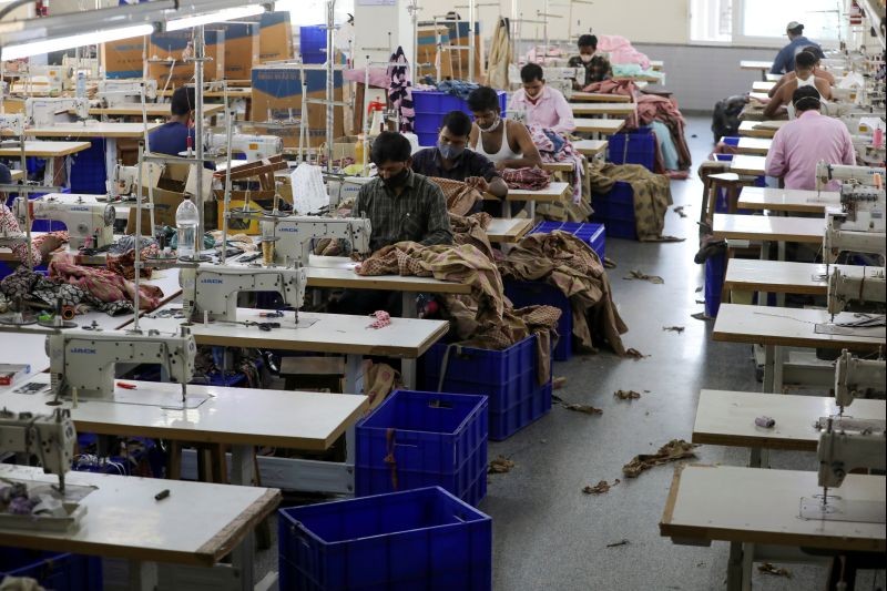 Workers stitch garments at a factory of an apparel shop in the city of Jaipur, India, October 20, 2020. Picture taken October 20, 2020. REUTERS/Anushree Fadnavis/File Photo