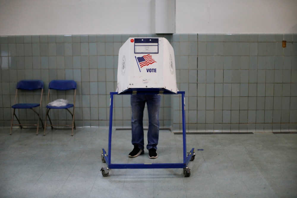 A voter fills out his ballot on election day in the Brooklyn borough of New York City, New York, U.S. November 3, 2020. REUTERS/Brendan McDermid