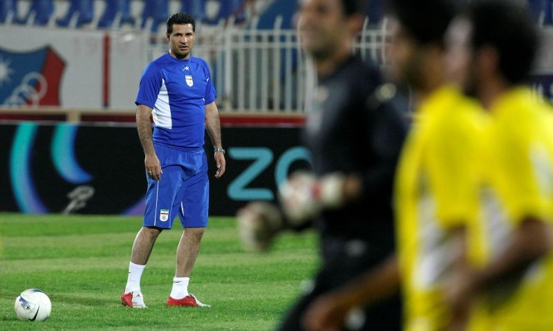 Former Iranian striker Ali Daei watches his team during a training session a day ahead of a World Cup 2010 qualifying match against Kuwait, in Kuwait City March 25, 2008. REUTERS/Tariq AlAli/File Photo