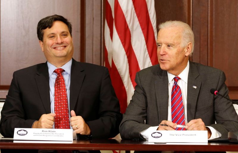 FILE PHOTO: U.S. Vice President Joe Biden (R) is joined by Ebola Response Coordinator Ron Klain (L) in the Eisenhower Executive Office Building on the White House complex in Washington, U.S. November 13, 2014. REUTERS/Larry Downing