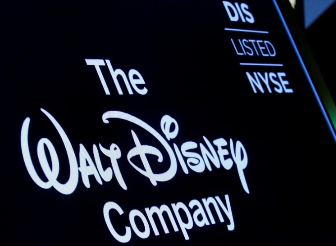 FILE PHOTO: A screen shows the logo and a ticker symbol for The Walt Disney Company on the floor of the New York Stock Exchange (NYSE) in New York, U.S., December 14, 2017. REUTERS/Brendan McDermid/File Photo