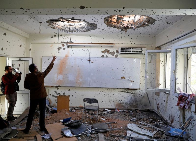 Afghan journalists film inside a classroom after yesterday's attack at the university of Kabul, Afghanistan November 3, 2020. (REUTERS Photo)