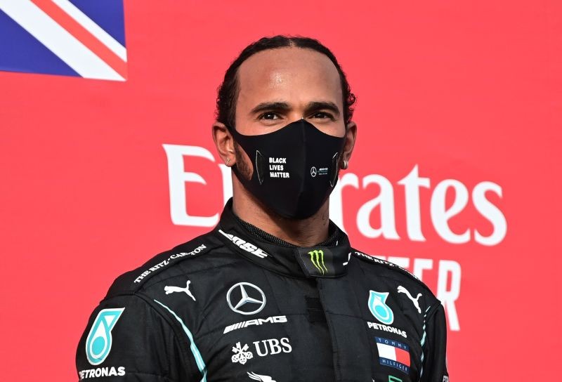 Mercedes' Lewis Hamilton on the podium after winning the race Pool via Reuters/Miguel Medina