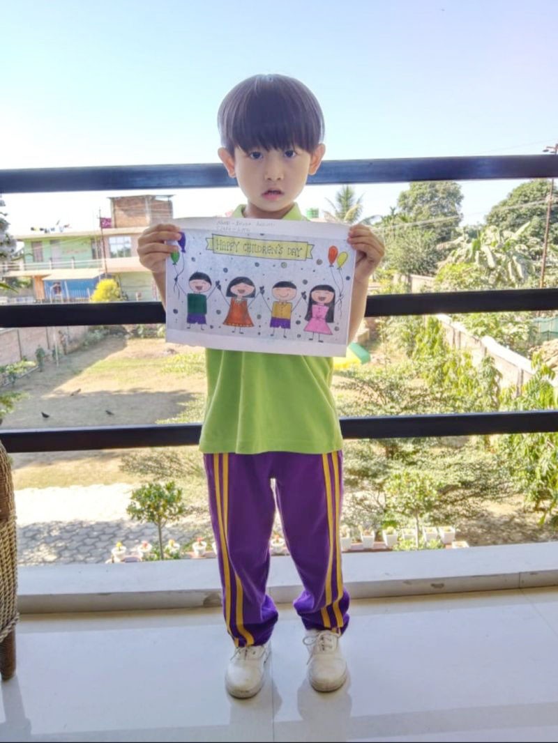 A student of DMI St. Joseph Global School holding up his drawing during the online competition which was held as part of the school’s Children’s Day celebration.
