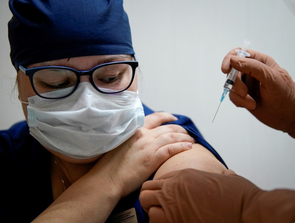 FILE PHOTO: A medic of the regional hospital receives Russia's "Sputnik-V" vaccine shot against the coronavirus disease (COVID-19) in Tver, Russia October 12, 2020. REUTERS/Tatyana Makeyeva/File Photo