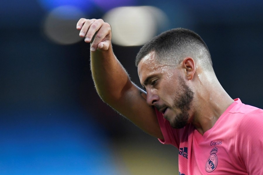 FILE PHOTO: Soccer Football - Champions League - Round of 16 Second Leg - Manchester City v Real Madrid - Etihad Stadium, Manchester, Britain - August 7, 2020 Real Madrid's Eden Hazard reacts, as play resumes behind closed doors following the outbreak of the coronavirus disease (COVID-19) Pool via REUTERS/Peter Powell