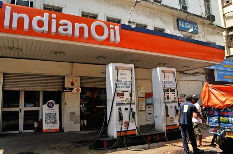 Indian Oil staff attend customers at a petrol pump in Kolkata on June 25, 2020. (IANS File Photo)