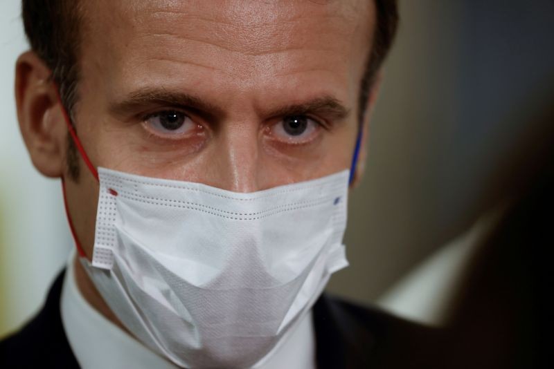 French President Emmanuel Macron listens during a visit to the 2020 Phoneton, an annual fundraising operation organised by the Hayastan All-Armenian Fund's French affiliate (Fonds Armenien de France) for the development of Armenia and Artsakh, in Paris, France November 21, 2020. Picture taken November 21, 2020. Ludovic Marin/Pool via REUTERS