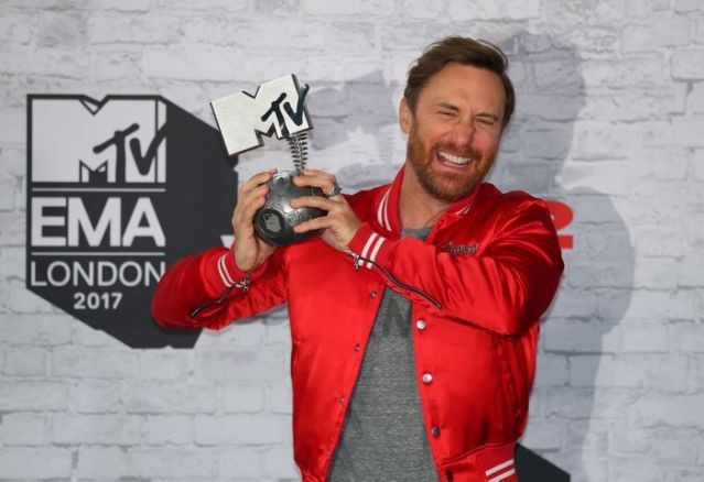 FILE PHOTO: French DJ David Guetta poses with his award during the 2017 MTV Europe Music Awards at Wembley Arena in London, Britain November 12, 2017. REUTERS//Hannah McKay/File Photo