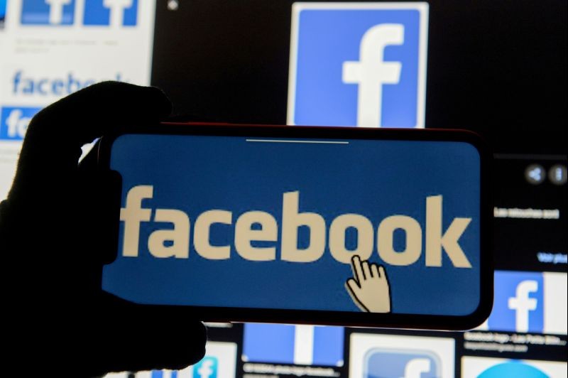The Facebook logo is displayed on a mobile phone in this picture illustration taken December 2, 2019. (REUTERS File Photo)