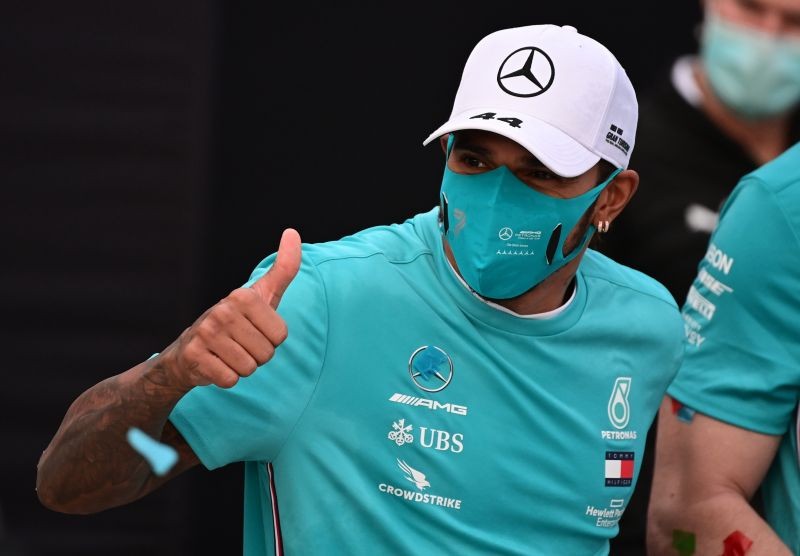 Race winner Lewis Hamilton as the Mercedes team celebrate winning the constructors championships Pool via Reuters/Miguel Medina