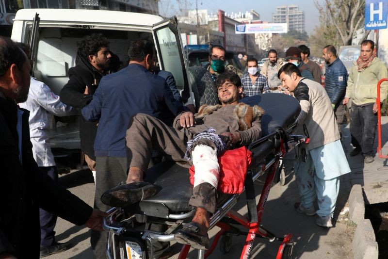 An injured man is carried to a hospital after rockets hit residential areas in Kabul, Afghanistan November 21, 2020. (REUTERS Photo)