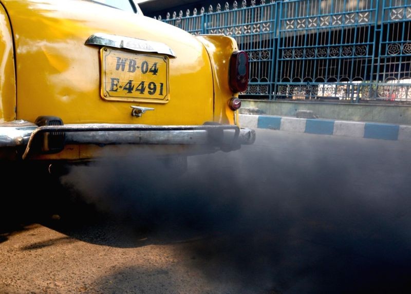 A car emitting smoke which is leading to air pollution, seen on the eve of World Environment Day, in Kolkata on June 4, 2019. (IANS File Photo)
