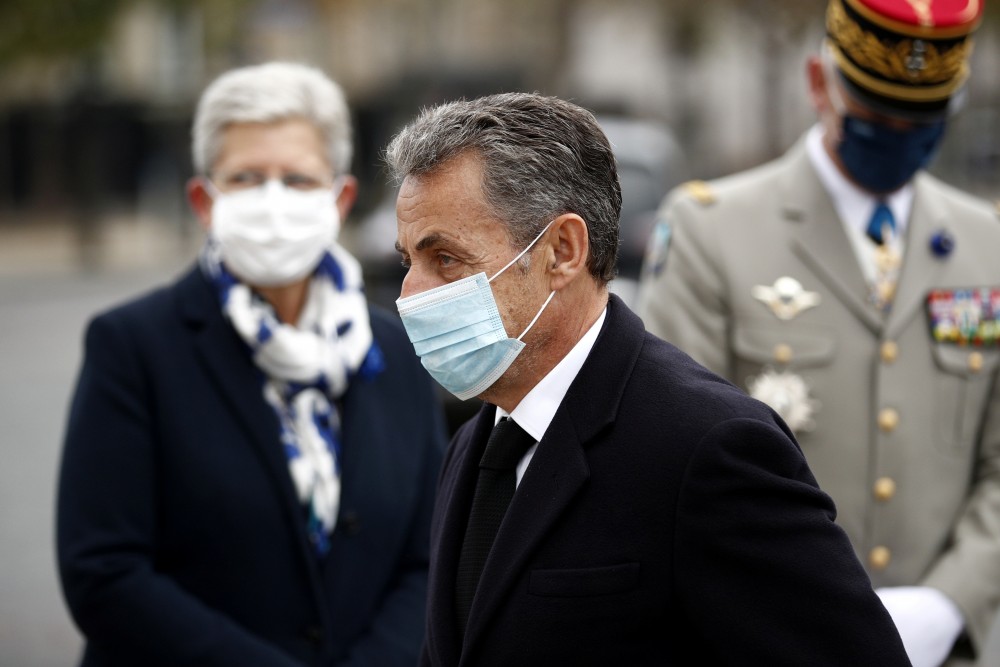 French former President Nicolas Sarkozy arrives for a ceremony at the Arc de Triomphe, as part of the commemorations marking the 102nd anniversary of the 11 November 1918 armistice, ending World War I in Paris, France, November 11, 2020. Yoan Valat/Pool via REUTERS