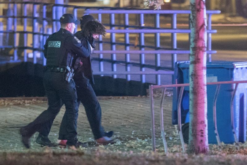Police officers detain a man in an area where multiple people were stabbed near the Parliament Hill area of Quebec City, Quebec, Canada November 1, 2020.  (REUTERS Photo)