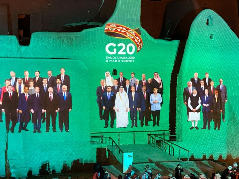 "Family Photo" for annual G20 Summit World Leaders is projected onto Salwa Palace in At-Turaif, one of Saudi Arabia's UNESCO World Heritage sites, in Diriyah, Saudi Arabia, November 20, 2020. (REUTERS Photo)