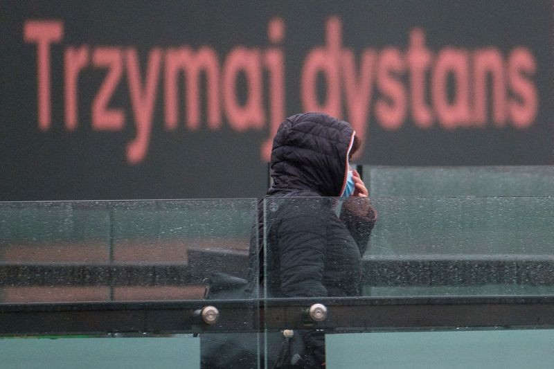 Woman wears a mask amid coronavirus disease (COVID-19) restrictions in Rzeszow, Poland, October 16, 2020. Sign reads "Keep distance". (REUTERS File Photo)