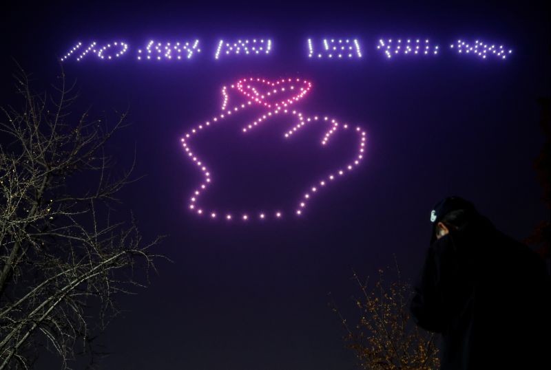Drones fly in formation showing messages of hope amid the coronavirus disease (COVID-19) outbreak in Seoul, South Korea November 13, 2020. (REUTERS Photo)