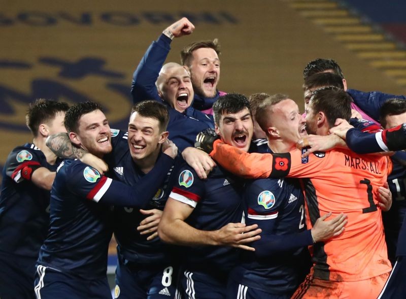 Scotland players celebrate after winning the match REUTERS/Marko Djurica