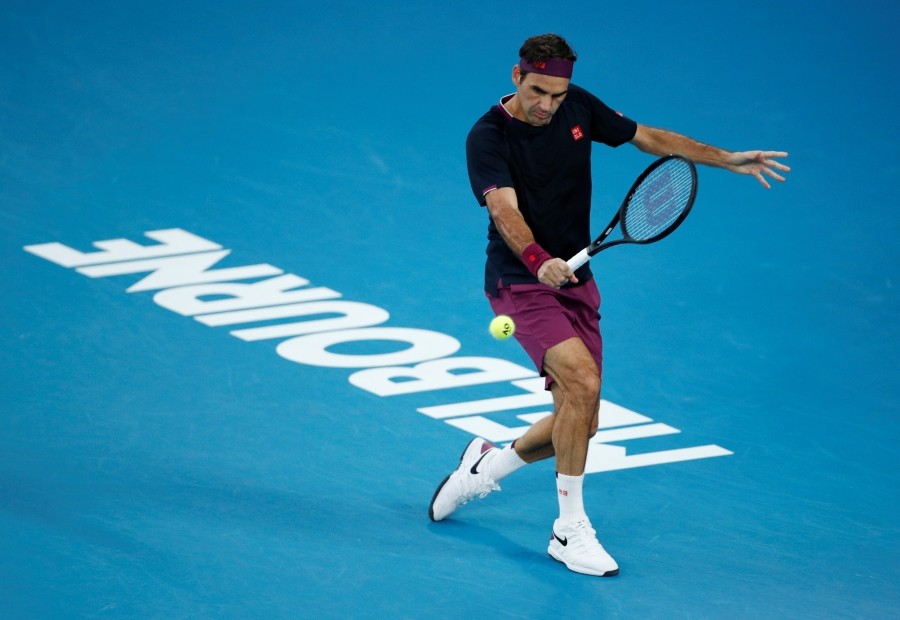 FILE PHOTO: Tennis - Australian Open - Semi Final - Melbourne Park, Melbourne, Australia - January 30, 2020. Switzerland's Roger Federer in action during his match against Serbia's Novak Djokovic. REUTERS/Edgar Su/File Photo