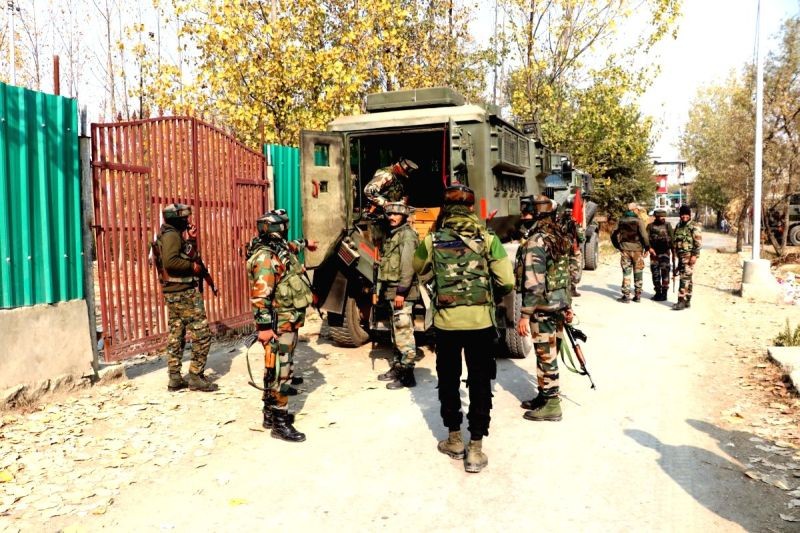 Security personnel at the site of encounter between security forces and terrorists at Pampore in South Kashmir's Pulwama district on Nov 6, 2020. (IANS Photo)